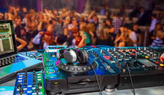 DJ equipment in front of a crowd