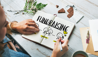 fundraising graphic on a desk.