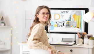 woman at computer working on graphic designs